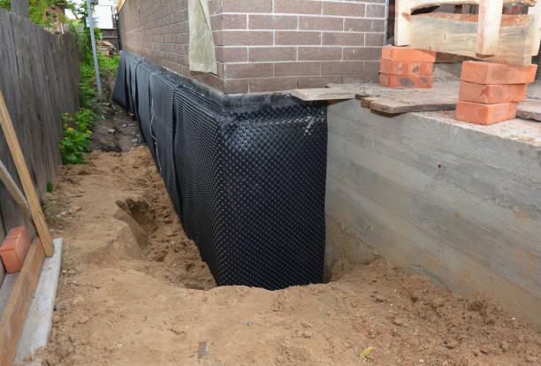 Happy homeowners after waterproofing job in Walkerton